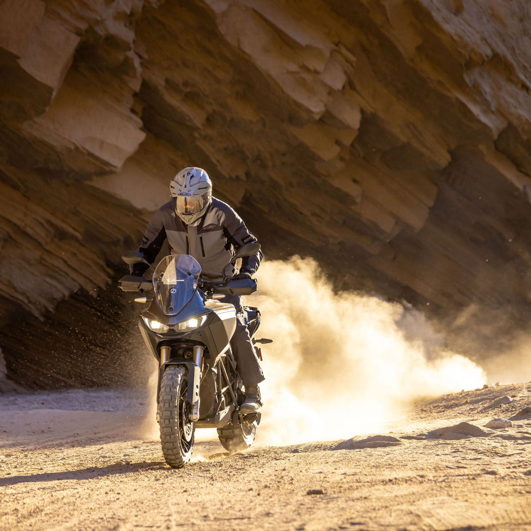 Noru Hakken Adventure Waterproof Jacket Grey - Lifestyle of Rider Wearing Jacket While Riding Grey Dual Sport Motorcycle