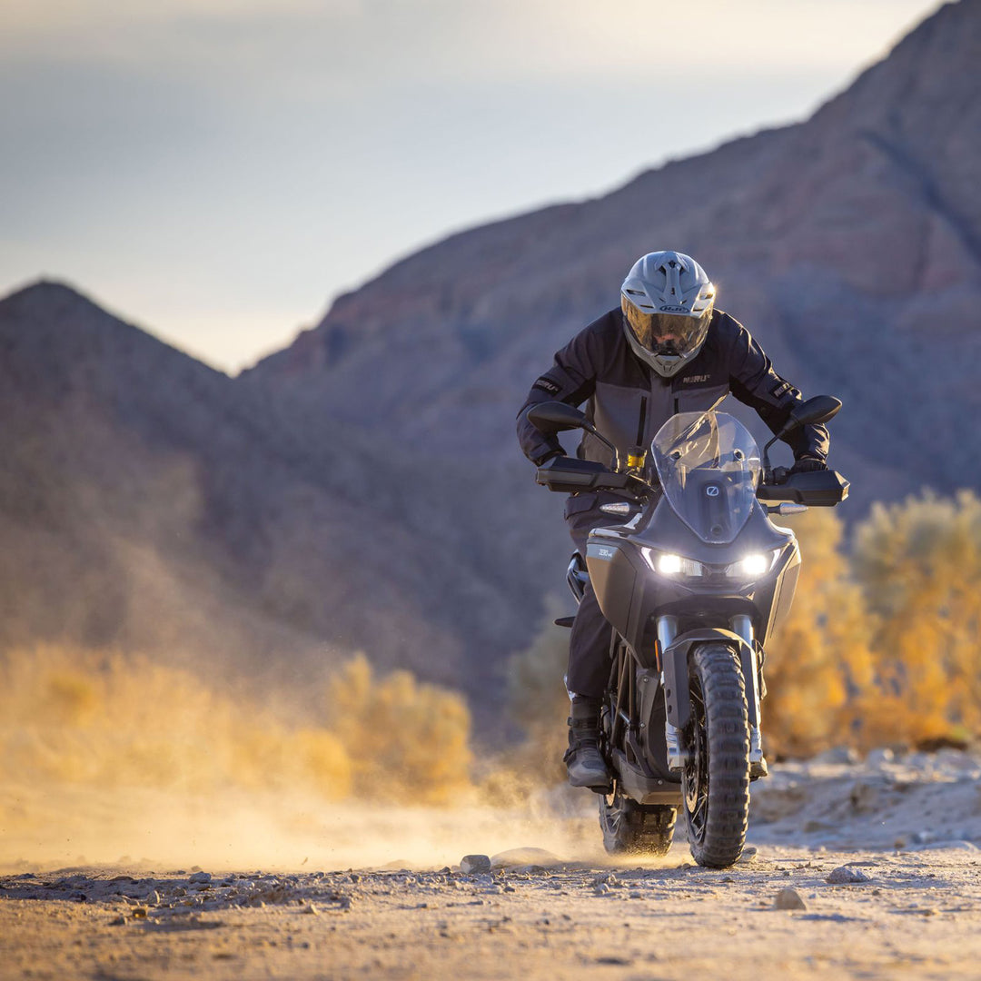 Noru Hakken Adventure Waterproof Jacket Grey - Lifestyle of Rider Wearing Jacket While Riding Grey Dual Sport Motorcycle