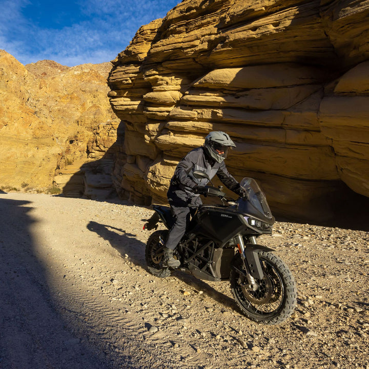 Noru Hakken Adventure Waterproof Pants Grey - Lifestyle of Rider Wearing Pants while Riding Black Adventure Motorcycle