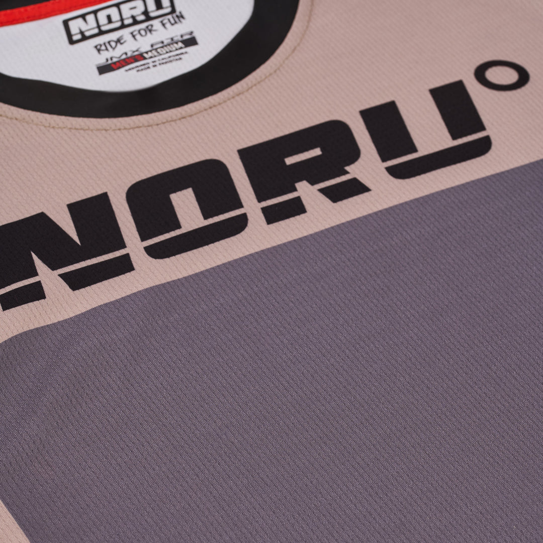 Noru Off-Road JMX Vented Jersey Sand/Grey - Close-Up of Front Logo Graphic