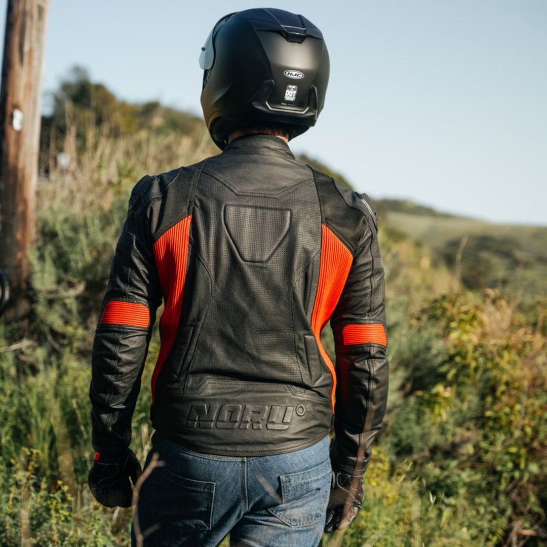 Noru Kaneda Leather Jacket Black/Red - Lifestyle Shot of Rider Wearing Jacket Looking over Field