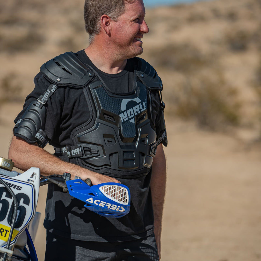 Noru Mamoru SX Roost Guard Black - Lifestyle of Rider Wearing Roost Guard Standing Next to Bike