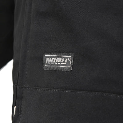 Noru Spanner Jacket Black - Close-Up of Brand Logo Tag on Lower Front