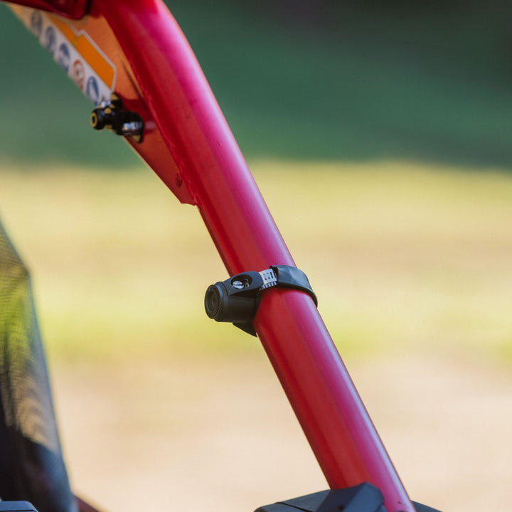 Quad Lock 360 Base - Hose Clamp - Lifestyle Close-Up of Hose Clamp Installed on Red UTV Side Bar