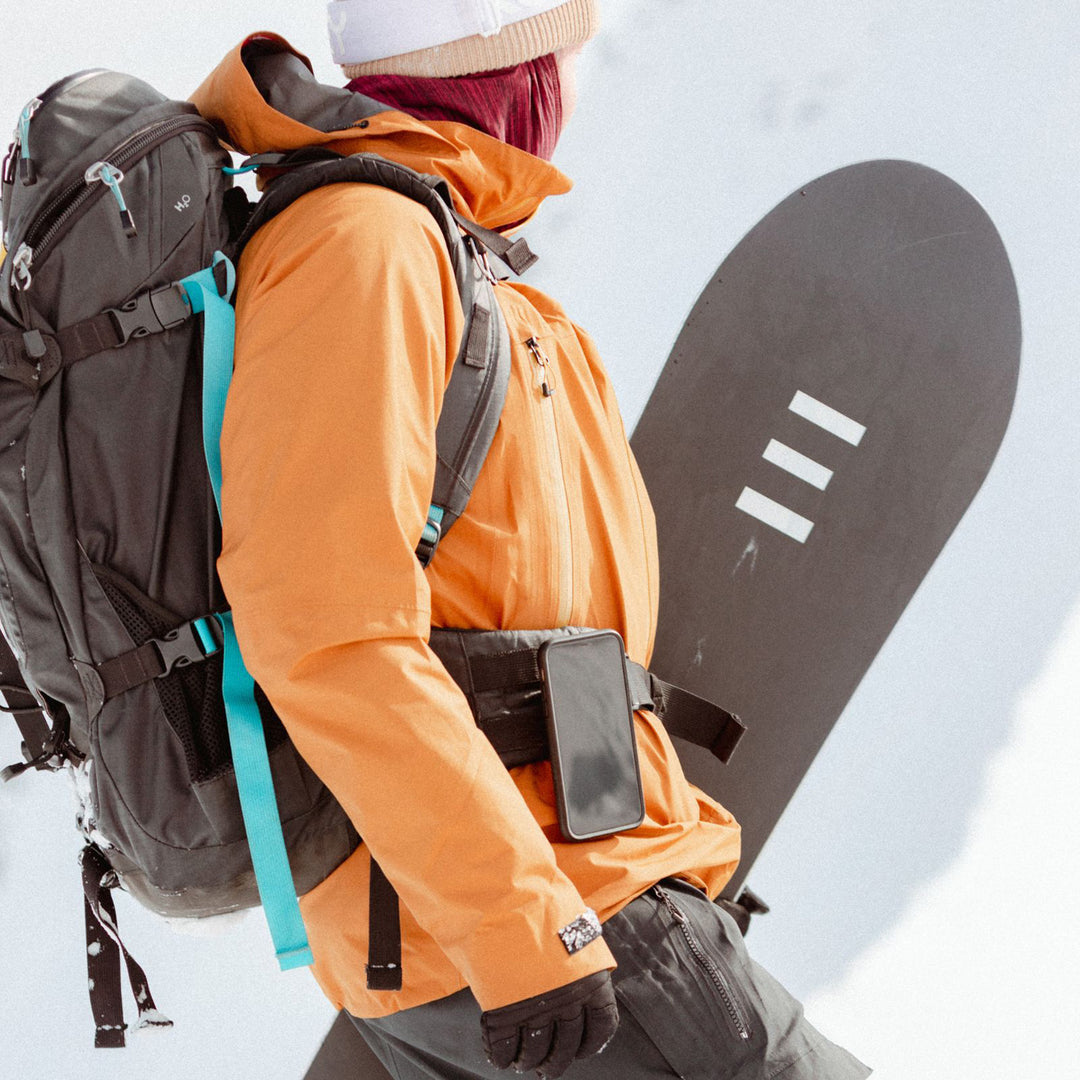 Quad Lock Belt/Utility Clip (V3) - Lifestyle of Snow Boarder with Phone on Utility Clip Attached to Backpack Waist Strap