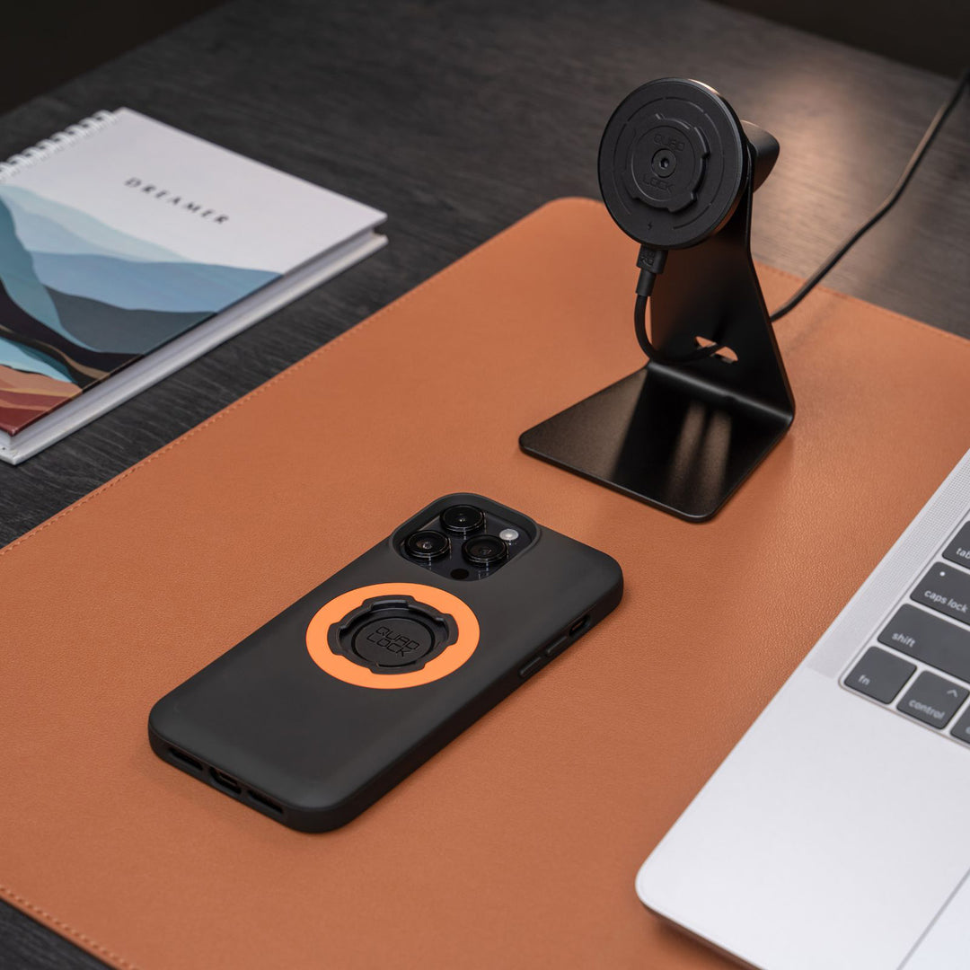 Quad Lock Desk Mount - V2 - Lifestyle Close-Up of Charging Head Attached to Desk Mount