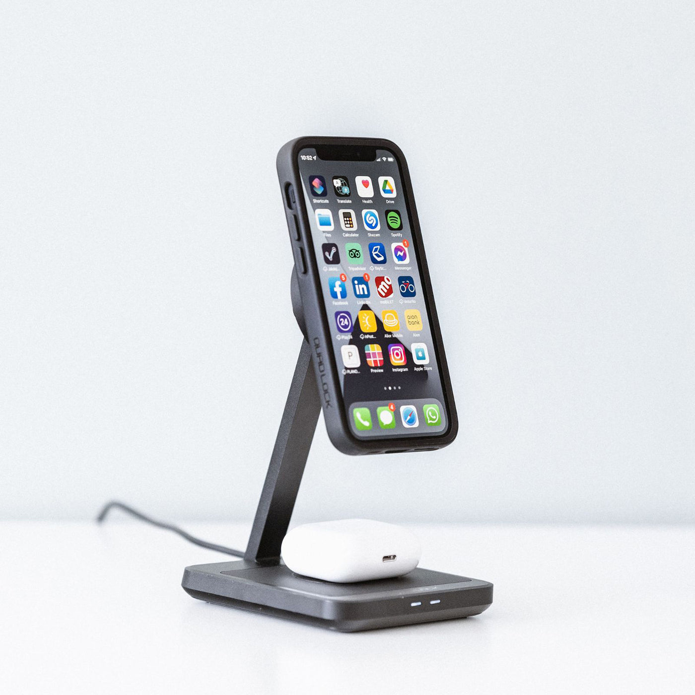 Quad Lock MAG Dual Desktop Wireless Charger - Lifestyle Focus on charger with phone attached