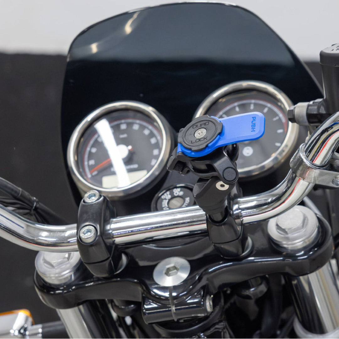 Quad Lock Motorcycle Handlebar Clamp Mount - Lifestyle Overshot of Mount Installed in Handlebar Clamp