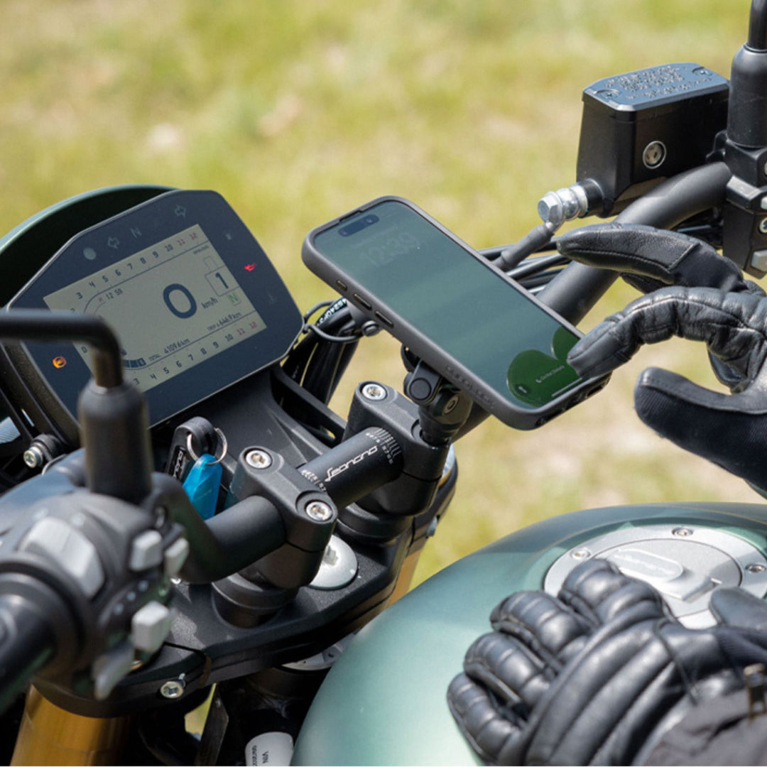 Quad Lock Motorcycle Handlebar Clamp Mount Pro - Lifestyle of Rider Using Phone Help Up by Mount