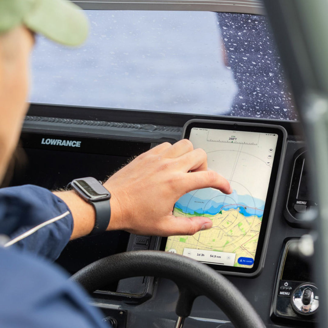 Quad Lock iPad Case - iPad Mini 6 MAG - Lifestyle of Driver Using GPS on iPad Attached to Boat Dashboard
