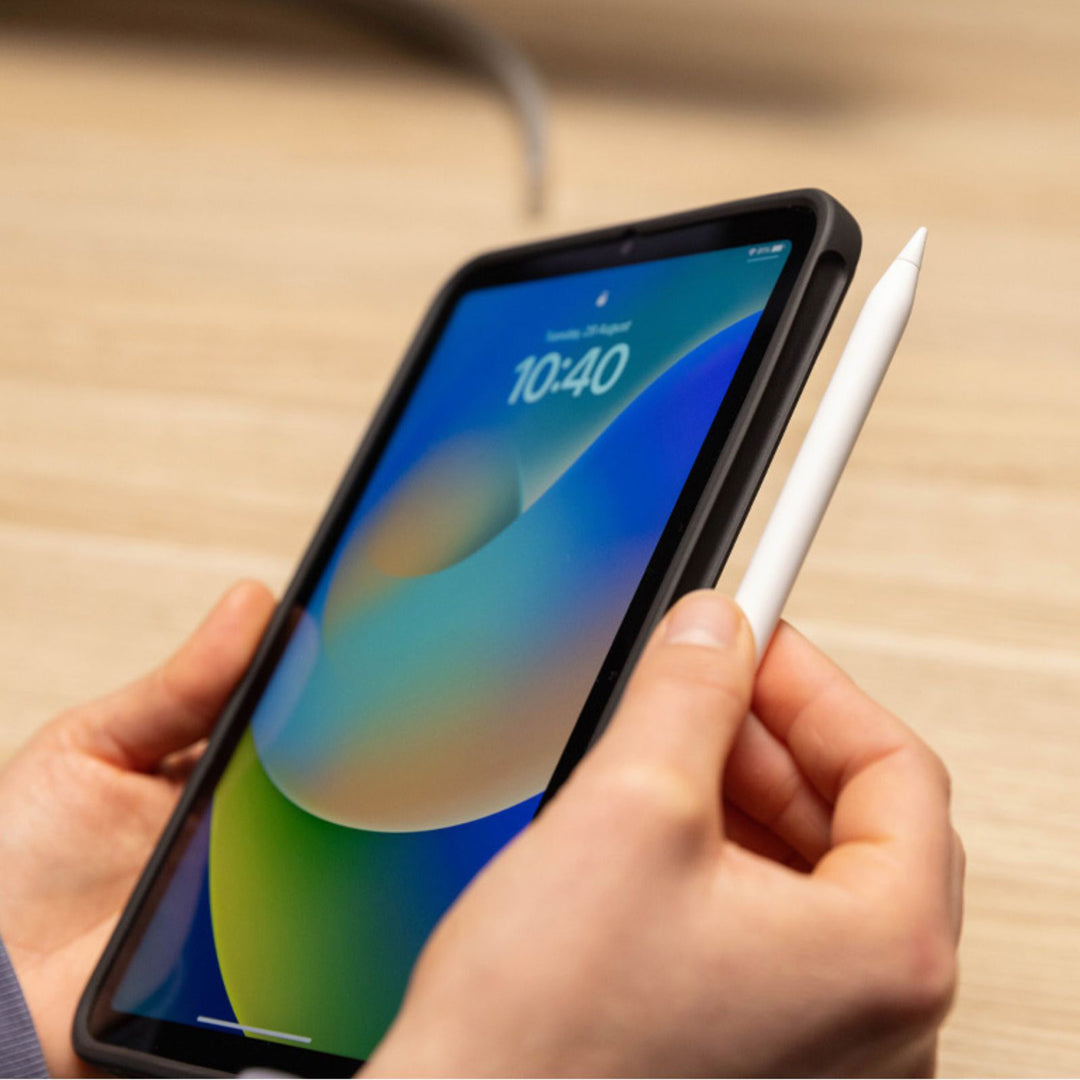 Quad Lock iPad Case - iPad Mini 6 MAG - Lifestyle Close-Up of Used Clipping Apple Pen to Side of iPad Case