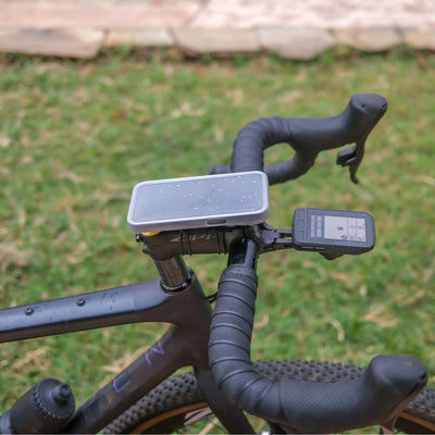 Quad Lock Phone Poncho - iPhone 16 Series - Lifestyle Shot of Bicycle Handlebar Set-Up