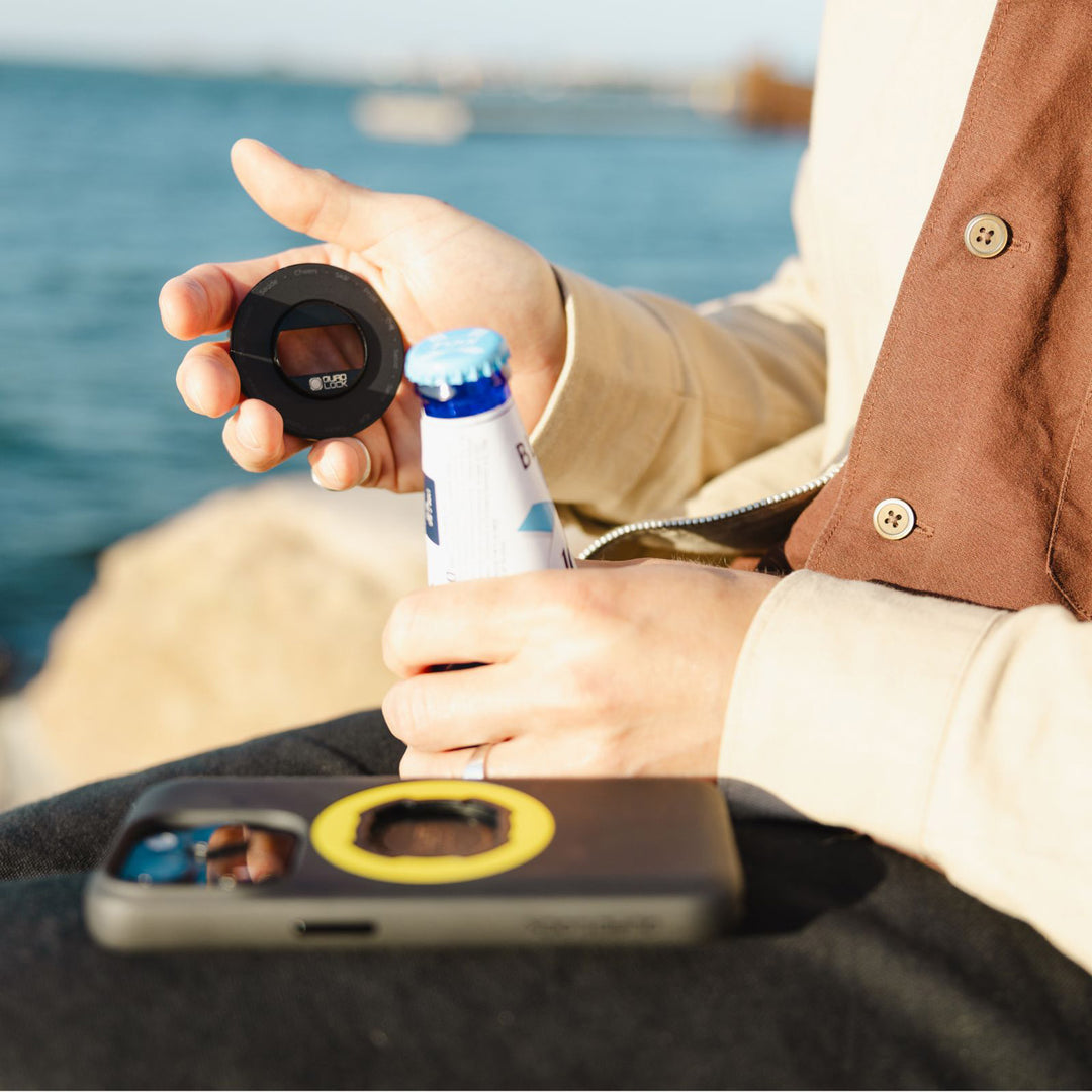 Quad Lock MAG Phone Ring Grip/Stand/Bottle Opener - Lifestyle of User About to Use Ring Bottle Opener to Open Bottle