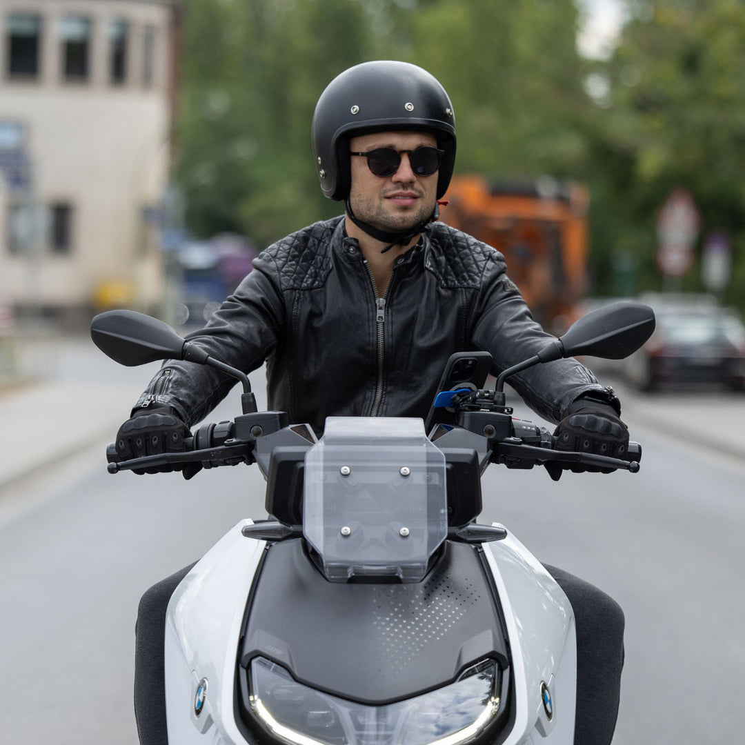 Quad Lock Motorcycle Brake Reservoir Mount (V2) - Lifestyle of Rider on Silver Motorcycle with Mount Installed