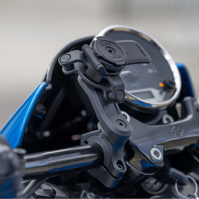 Quad Lock Motorcycle Handlebar Mount Pro - Lifestyle Close-Up of handlebar mount on motorcycle handlebar