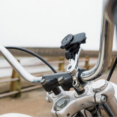 Quad Lock Motorcycle Handlebar Mount Pro - Lifestyle Shot of handlebar mount on motorcycle handlebar