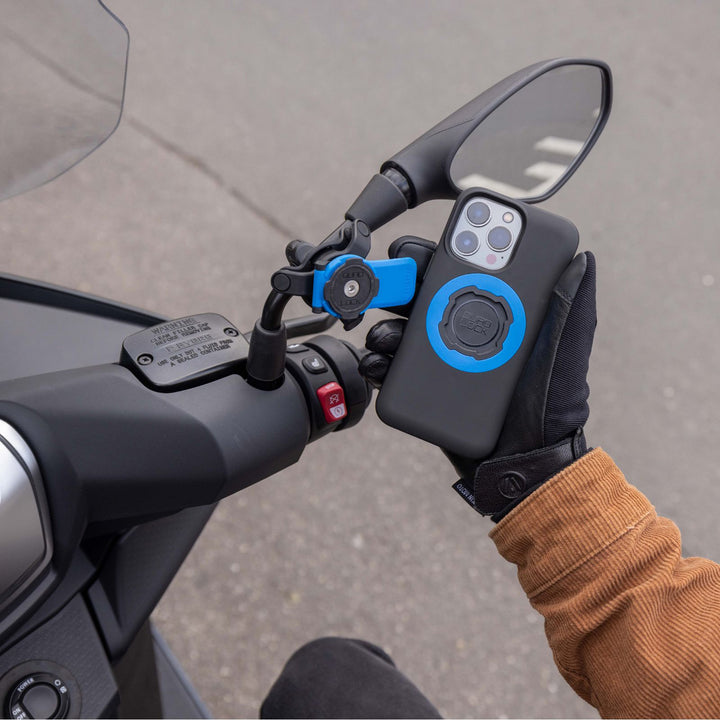 Quad Lock Motorcycle/Scooter Mirror Mount (V2) - Lifestyle Close-Up of Rider Lining Up Phone Case with Head Lever on Mount