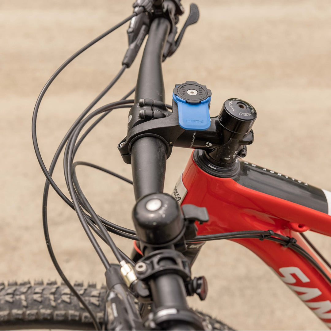 Quad Lock Out Front Mount - Lifestyle Close-Up of Mount Installed on Bicycle Handlebar