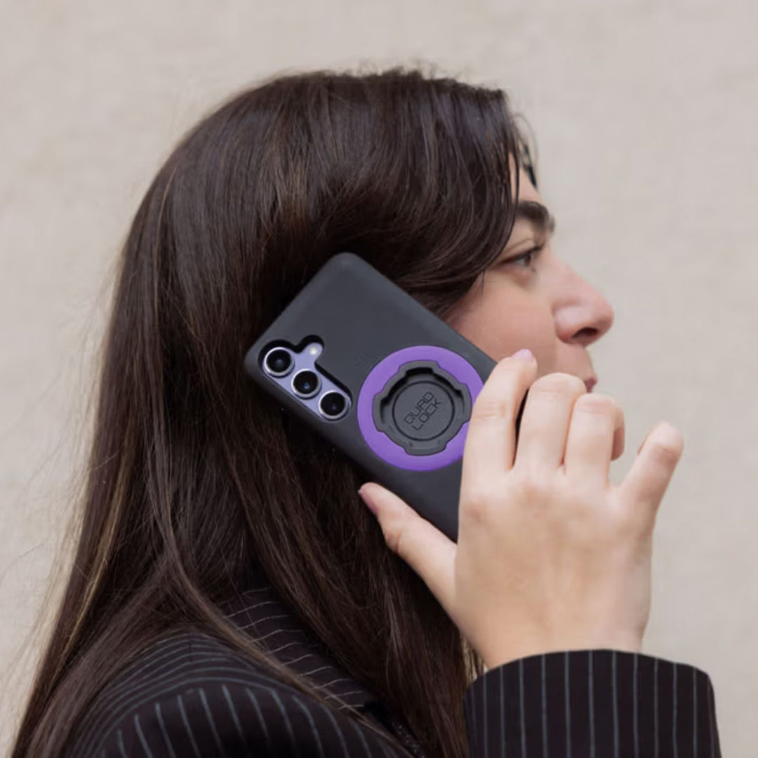 Quad Lock Phone Case - Samsung Galaxy S25 Series - Lifestyle of Model Talking on Phone with Case Installed