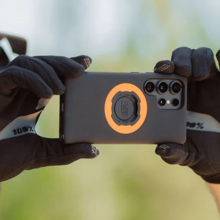 Quad Lock Phone Case - Samsung Galaxy S25 Series - Lifestyle Close-Up of Model Taking Picture with Phone with Case