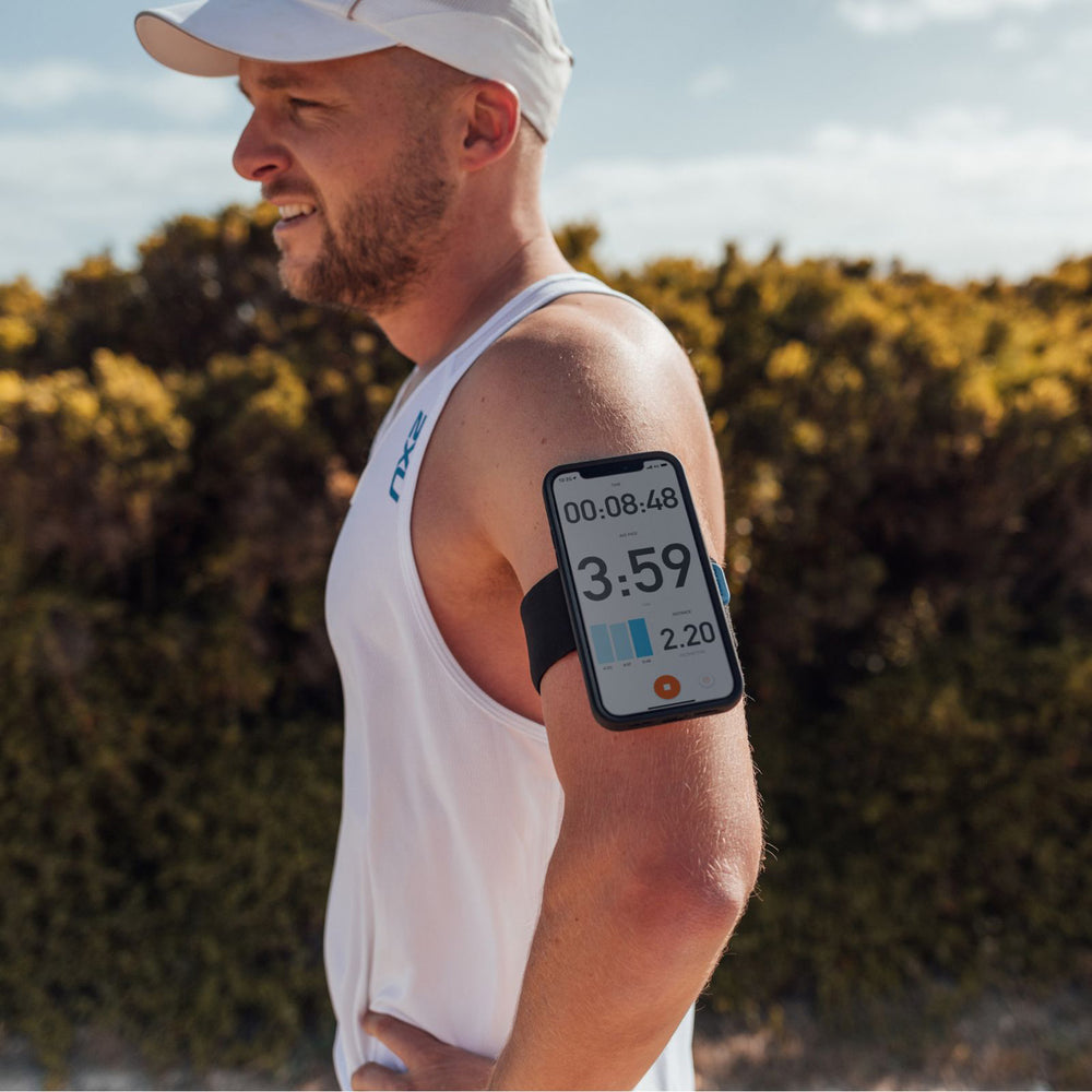 Quad Lock Sports Armband - Lifestyle of Jogger with Phone on Armband