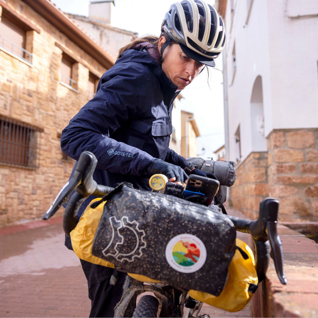 Quad Lock Stem/Handlebar Bike Mount - Lifestyle of Cyclist Checking Phone on Handlebar Mount