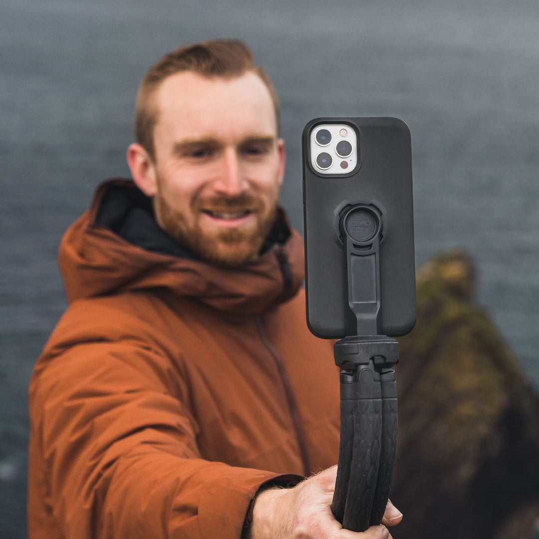 Quad Lock Tripod Adaptor (V3) - Lifestyle of Model Taking Selfie with Phone on Tripod