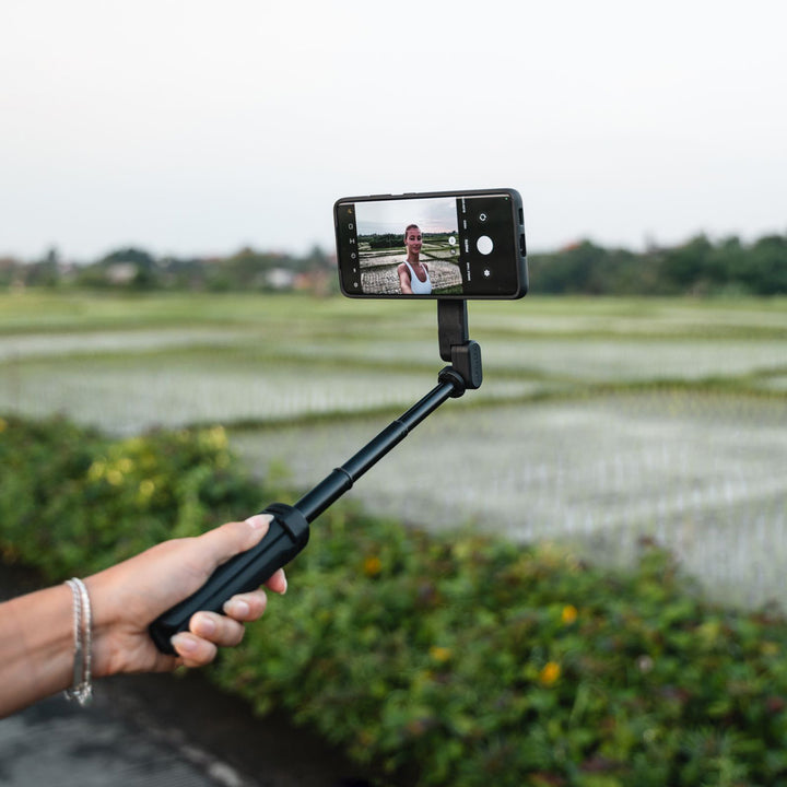 Quad Lock Tripod/Selfie Stick - Lifestyle of Model Using Selfie Stick
