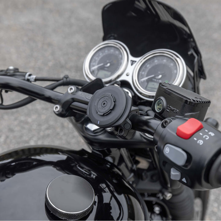Quad Lock USB Weatherproof Wireless Charging Head - Lifestyle of Charging Head on Motorcycle Handlebar Mount