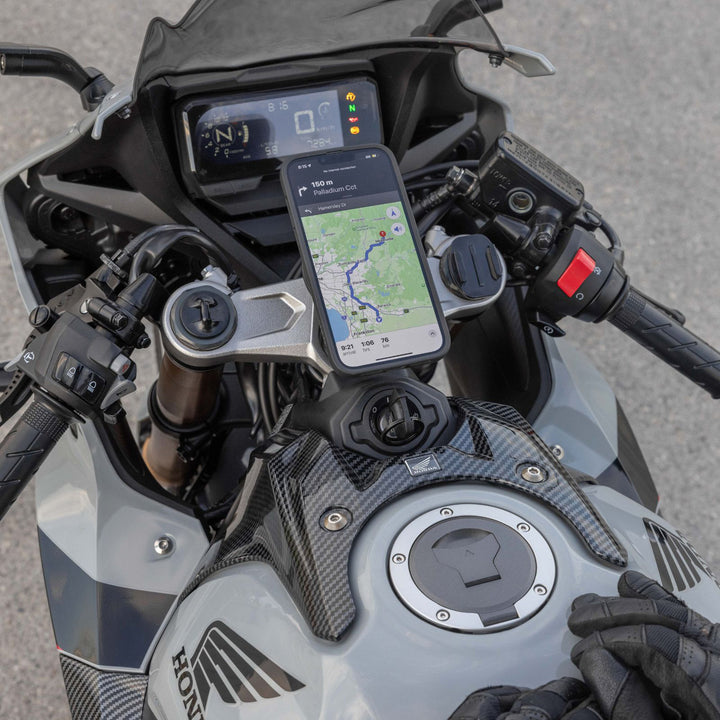 Quad Lock USB Weatherproof Wireless Charging Head - Lifestyle of Phone with Maps Open Mounted on Charging Head