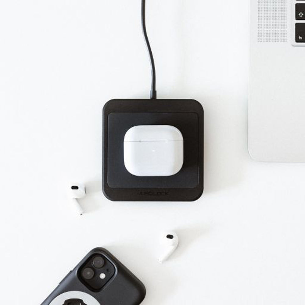 Quad Lock Wireless Charging Pad - Lifestyle of Headphone Case on Charging Pad
