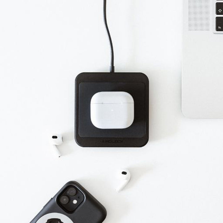 Quad Lock Wireless Charging Pad - Lifestyle of Headphone Case on Charging Pad