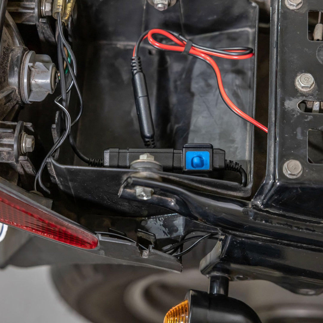 Quad Lock Waterproof 12V to USB Smart Adaptor - Lifestyle Close-Up of Smart Adaptor Installed near Battery