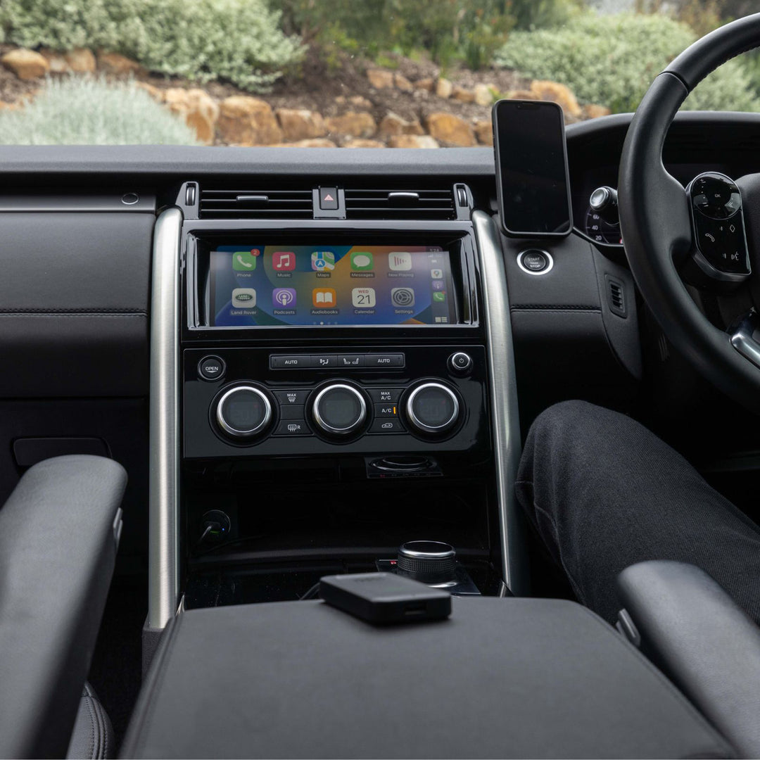 Quad Lock Wireless CarPlay Adaptor - Lifestyle Wide Shot of Adaptor placed on Center Console