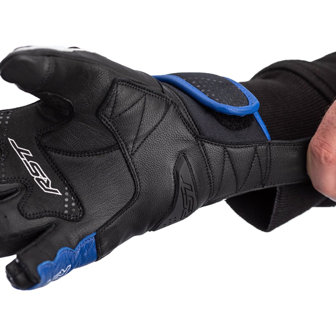 RST Freestyle 2 CE Gloves Black/Blue/White - Close-Up of Palm While Model Pulls On Glove