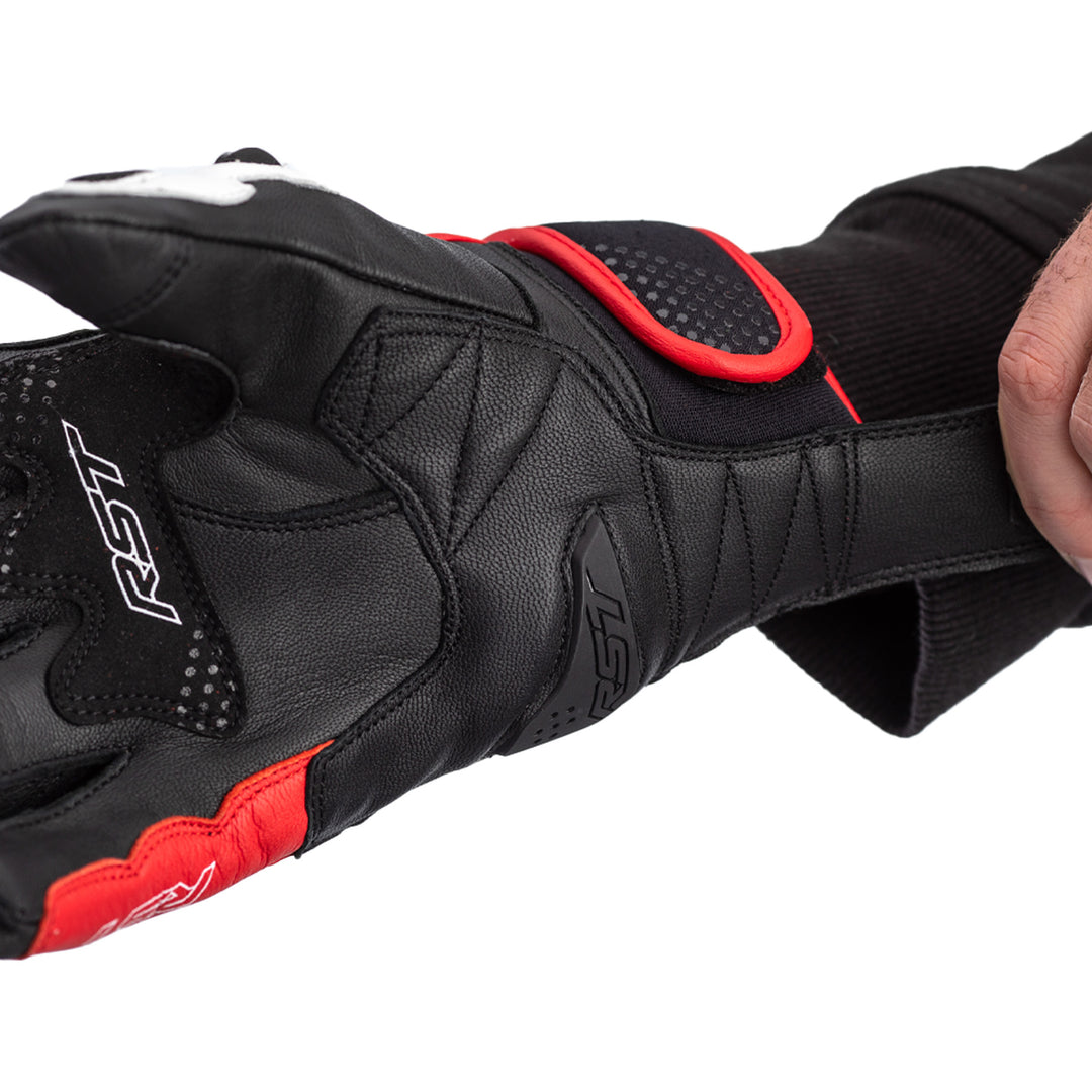 RST Freestyle 2 CE Gloves Black/Red/White - Close-Up of Palm While Model Pulls On Glove