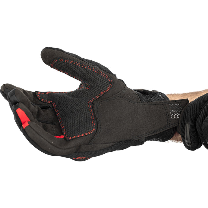 RST Rider CE Gloves Black/Red - Close-Up of Model Pulling on Glove