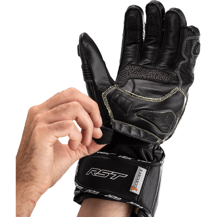 RST Tractech Evo 4 CE Gloves Black/Black/Black - Palm View of Model Adjusting Wrist Strap