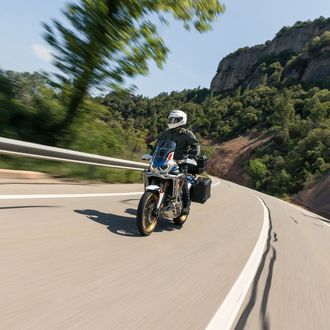 Shoei GT-Air 3 Solid Helmet White - Lifestyle of Rider Wearing Helmet on Adventure Motorcycle through Mountain Road