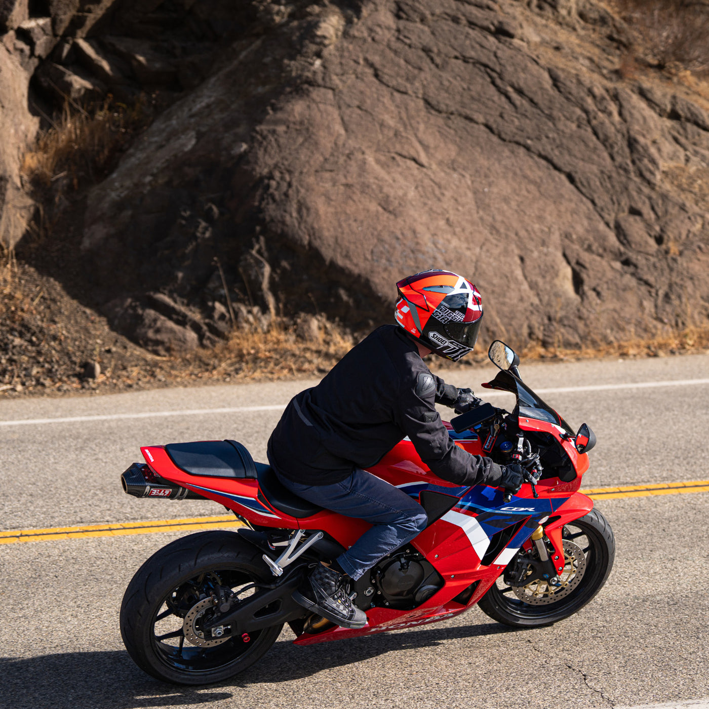 Shoei X-15 Diggia 2 Helmet TC-1 - lifestyle shot of rider on red motorcycle