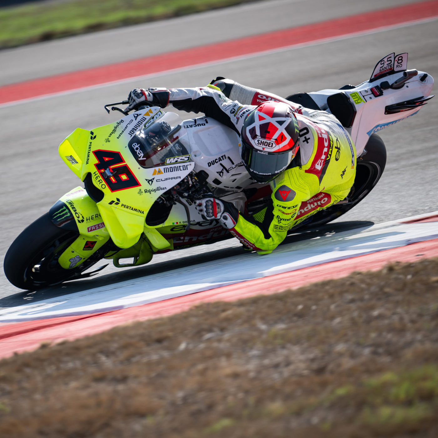 Shoei X-15 Diggia 2 Helmet TC-1 - lifestyle shot of racer wearing helmet on neon yellow motorcycle