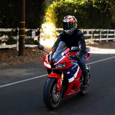 Shoei X-15 Diggia 2 Helmet TC-1 -  lifestyle shot of rider wearing helmet on red motorcycle