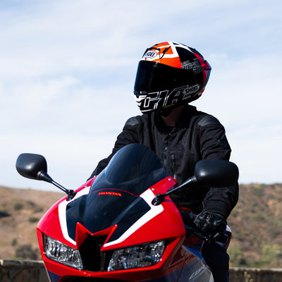 Shoei X-15 Diggia 2 Helmet TC-1 - Lifestyle shot of rider wearing helmet on red motorcycle