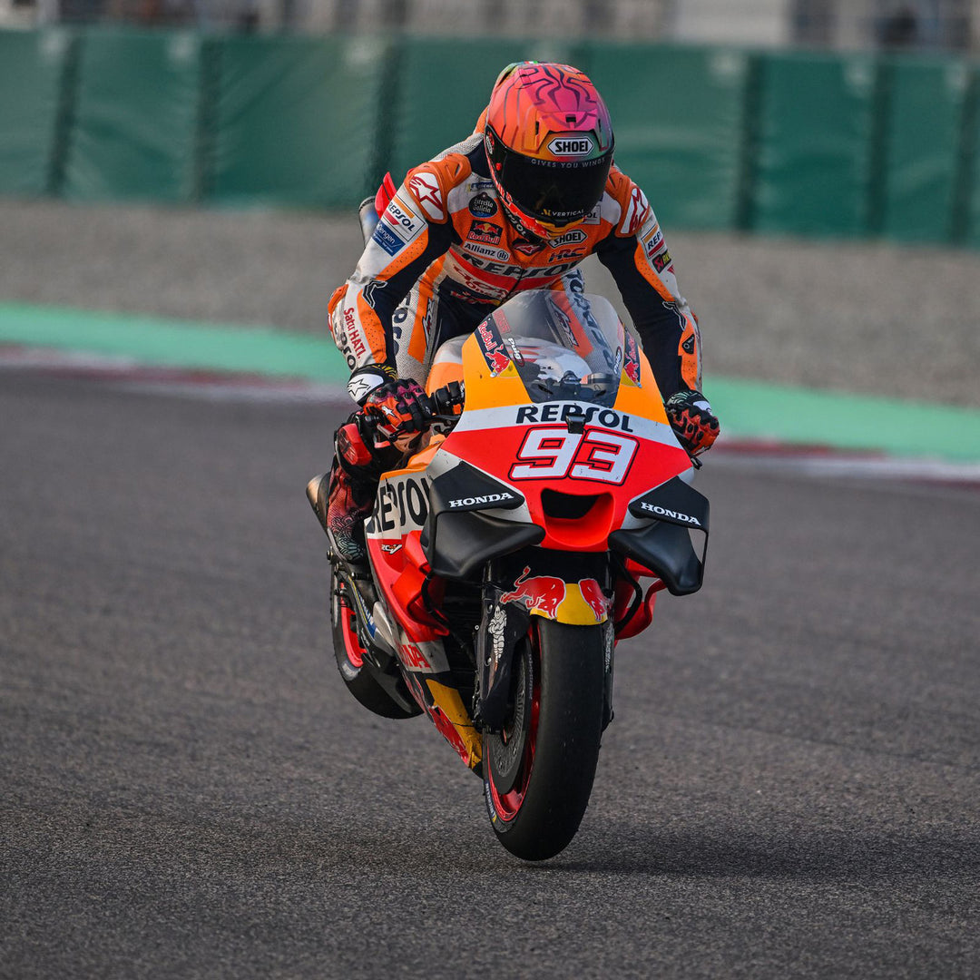 Shoei X-15 Marquez Holi Helmet TC-1 - Lifestyle of MotoGP Rider Marquez wearing helmet while endo-ing on race bike