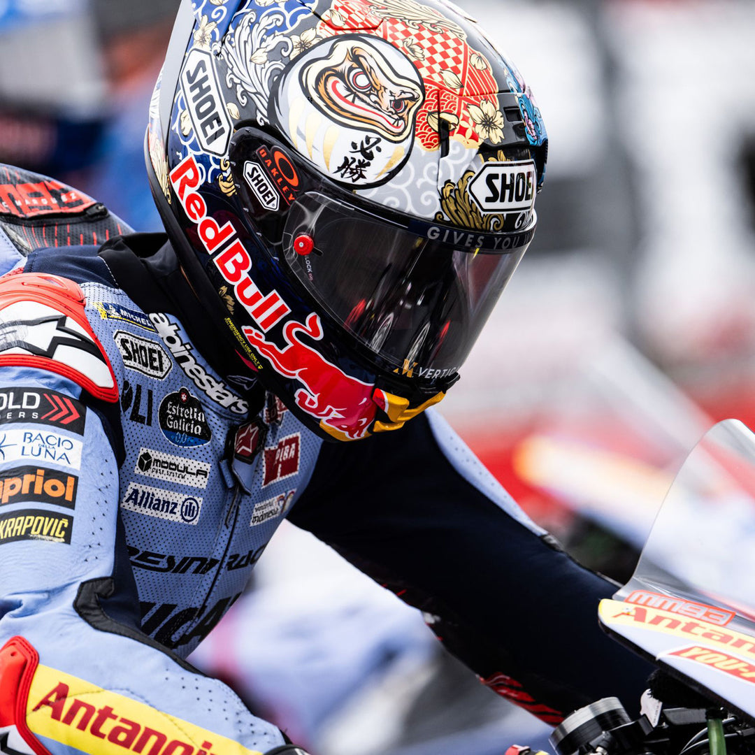 Shoei X-15 Marquez Motegi 5 Helmet TC-1 - Lifestyle of MotoGP Rider Marquez wearing helmet while sitting on race bike
