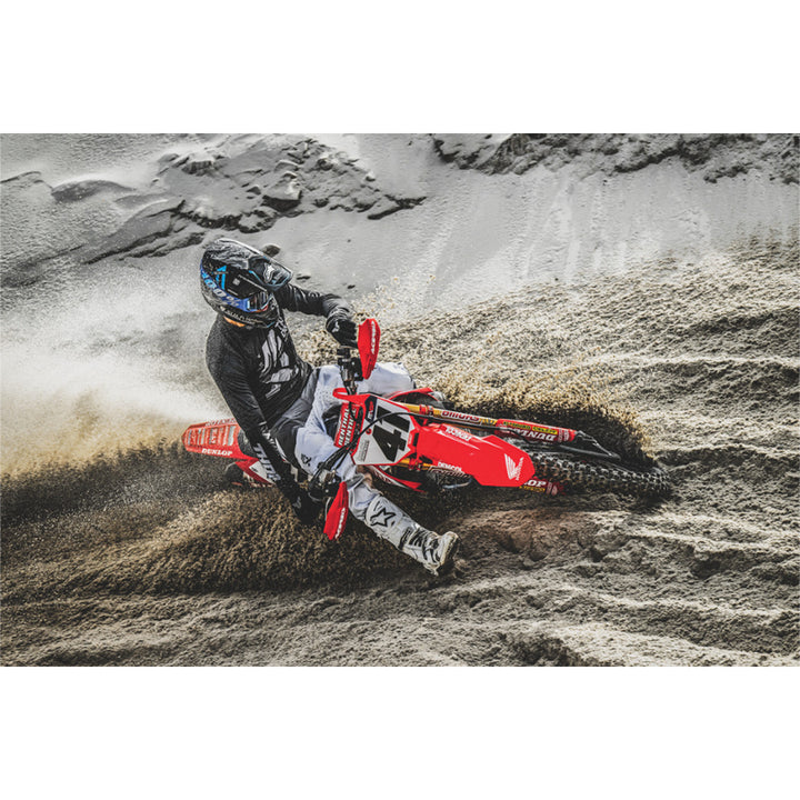 THOR LAUNCHMODE Brave Jersey Black/Gray - Lifestyle of Rider in Jersey Turning Hard on Dirt Track