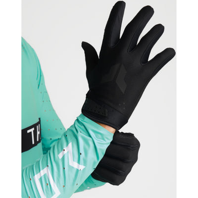 THOR LAUNCHMODE Gloves Black - Back of Hand View of Model Putting on Glove