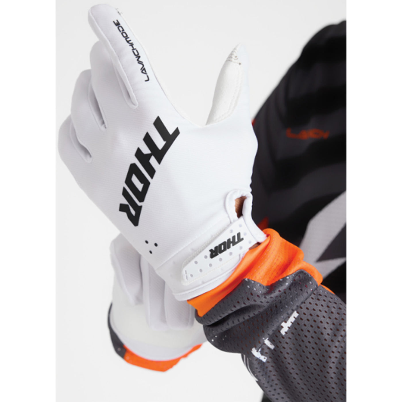 THOR LAUNCHMODE Gloves White - Back of Hand View of Model Putting on Glove