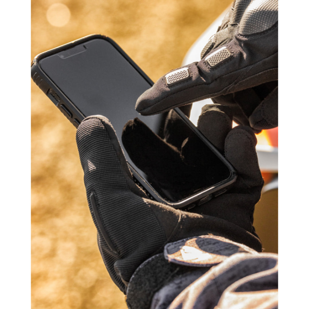 THOR Range Gloves Black - Lifestyle Close-Up of Gloved Hands Using Phone