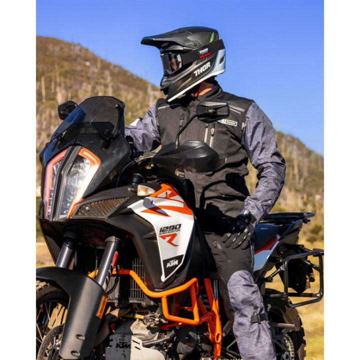 THOR Range Pants Black/Gray - Lifestyle of Rider Wearing Pants on Black and White Dual Sport Motorcycle